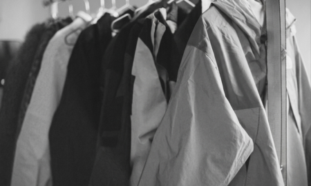 A lot of wind breaker jackets, soft shell jackets hanged